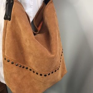 Maurizo Taiuti over the shoulder bag.